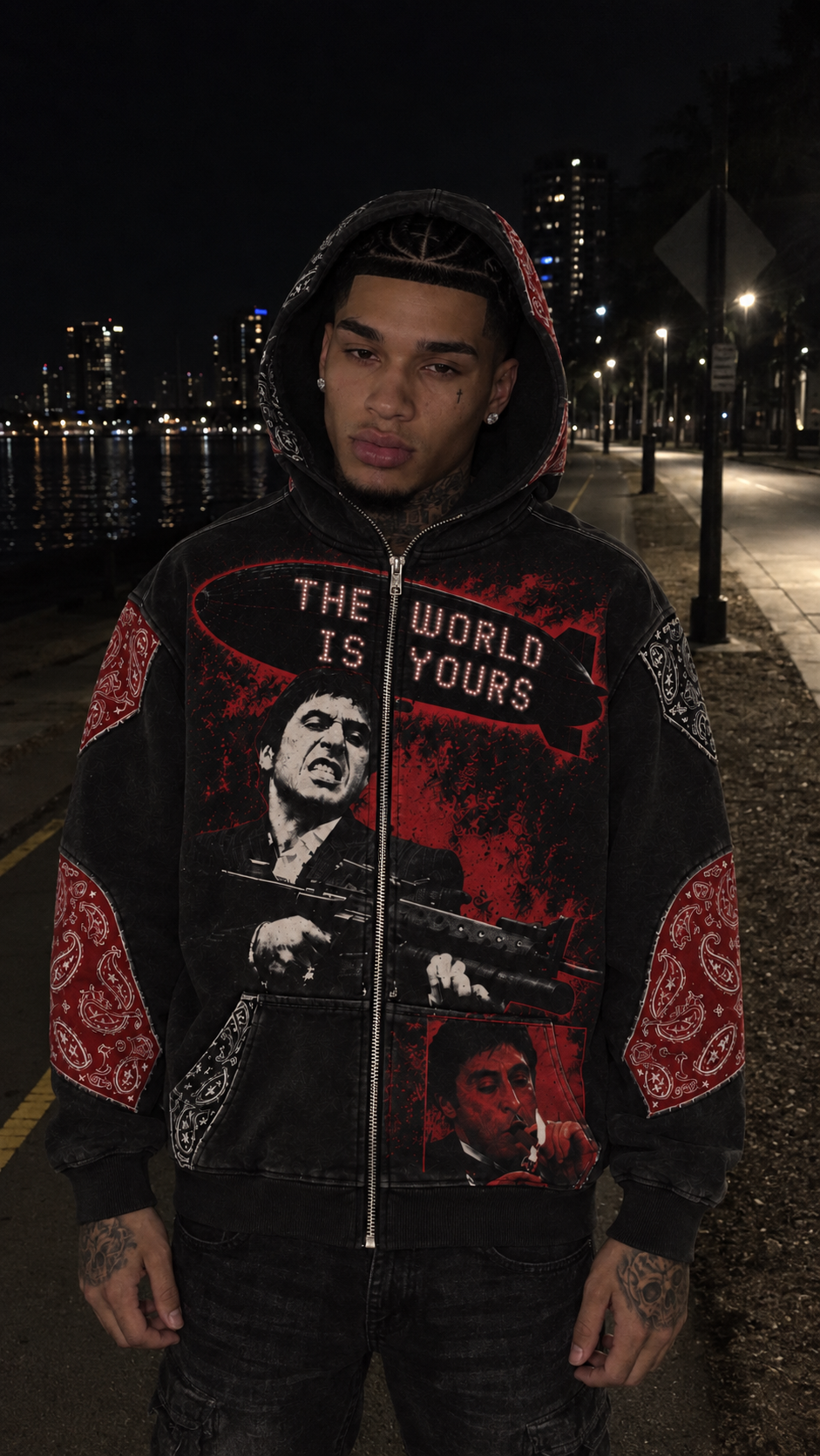 Black Scarface hoodie on a male model beside the Miami waterfront